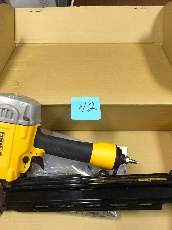 lot 42 image: DEWALT Pneumatic 21-Degree Collated Framing Nailer in working conditions