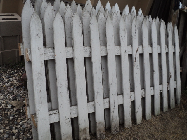 lot 5 image: 5 weathered white picket wood fenci...