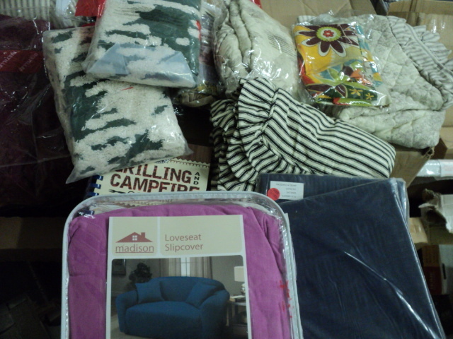 lot 29 image: loveseat cover and various shams...