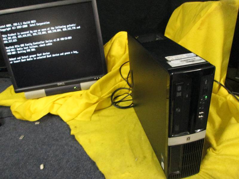 lot 221 image: Computer Tower, loads screen pictured, no further testing.  Tower only, SCREEN INCLUDED FOR DEMONSTRATION ONLY