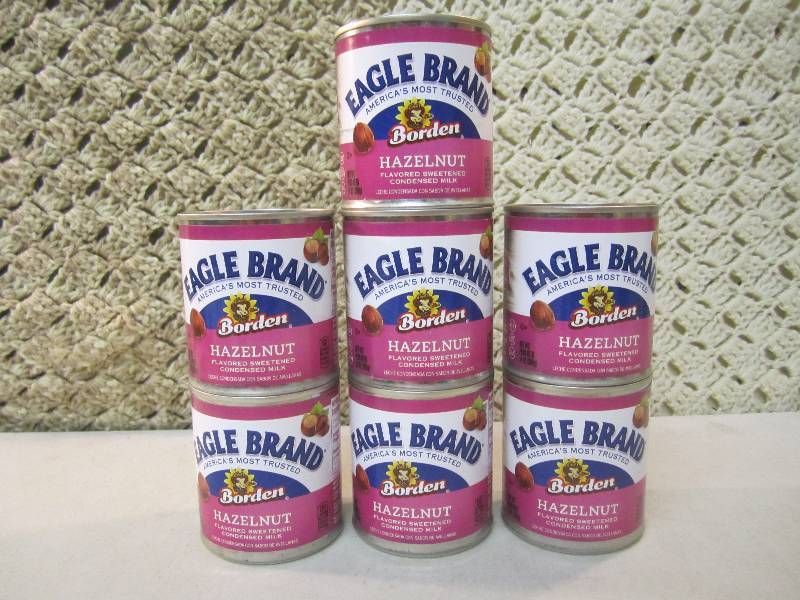 lot 112 image: 7 Cans of Hazelnut Flavored Sweeten...