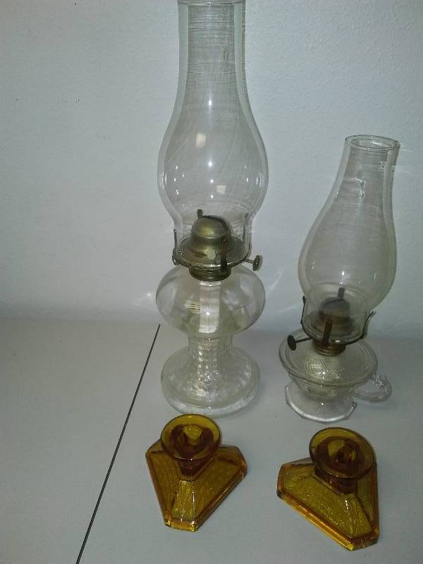 lot 102 image: oil lamps (2) antique candle(2)