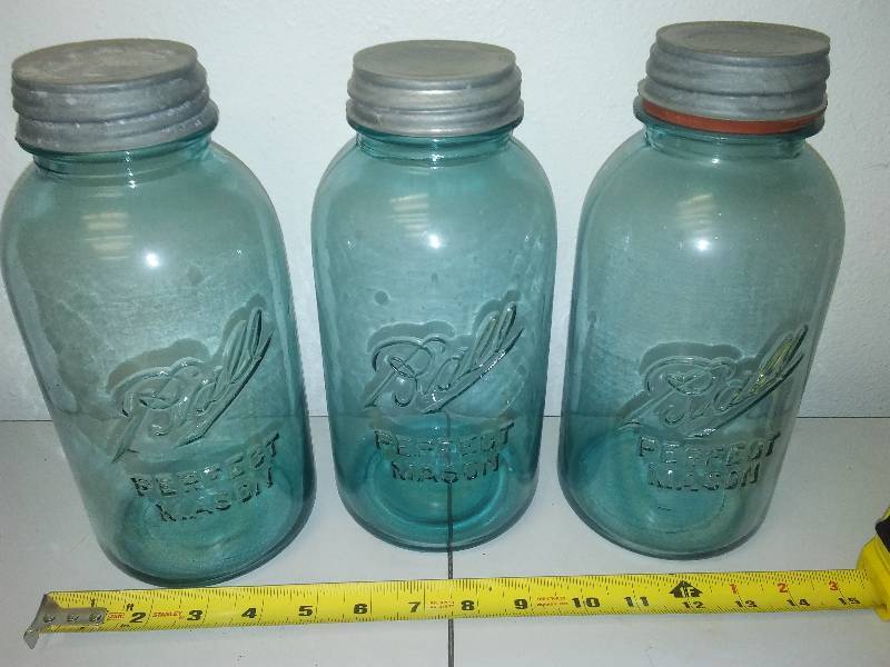 lot 173 image: 64 Oz Blue Glass and galvanized covers (3)