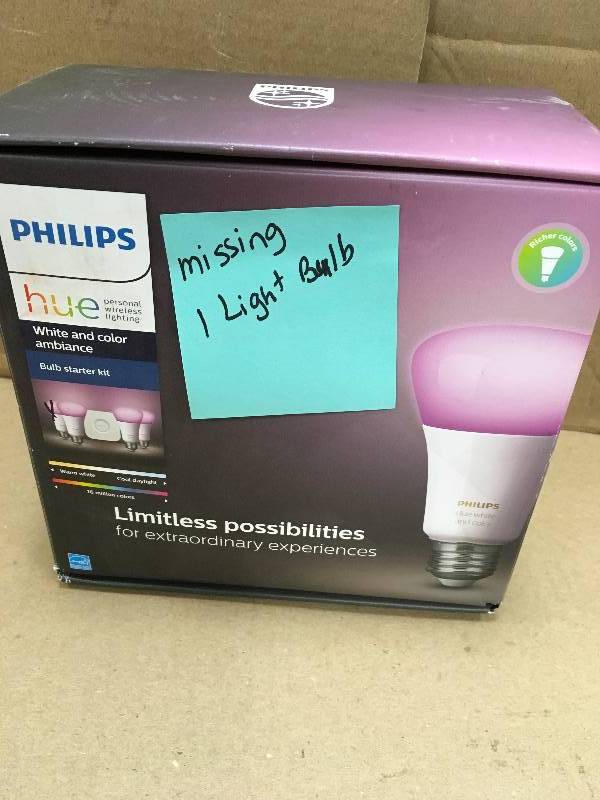 lot 14 image: Philips Hue White and Color Ambiance A19 LED 60W Equiv. Dimmable Smart Wireless Lighting Starter Kit (4 Bulbs, and Bridge). Missing one light bulb.