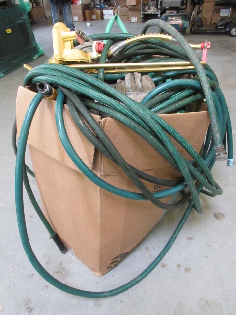 lot 134 image: BOX OF GARDEN HOSE, HOSE HANGER AND SPRINKLER