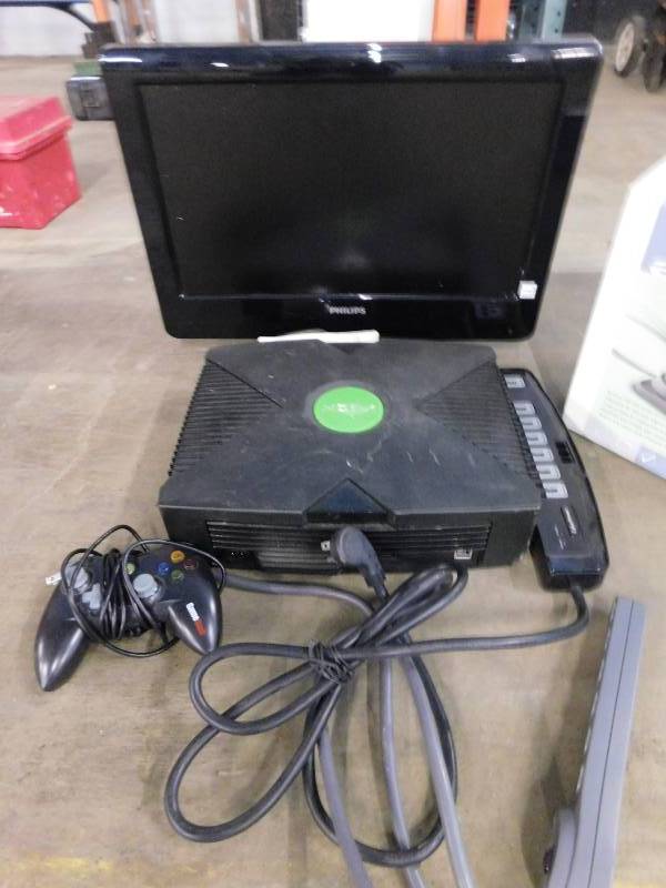lot 19 image: Flat Screen TV, X Box Game, Power Strips