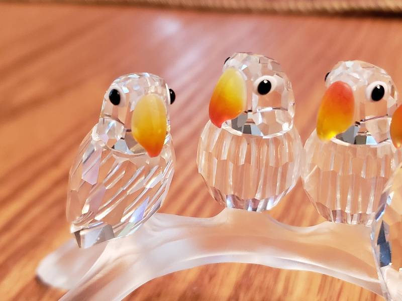 lot 100 image: Swarovski Crystal Parrots on a Brand Figure - Collectible