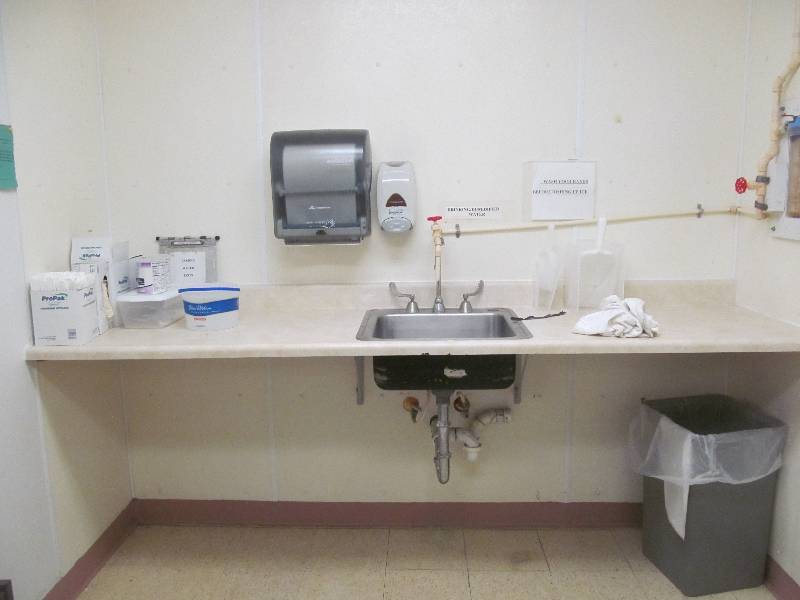 lot 4 image: 1st Room to the right Sink w counter