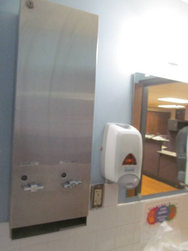 lot 83 image: Womens Rest Room, Dispensers (towel, soap, tampon), sink, toilet, mirror, light