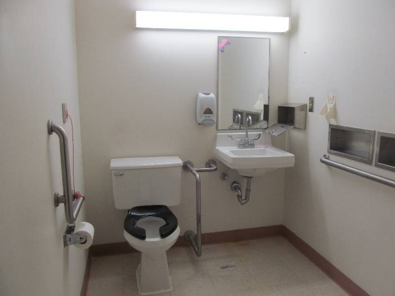 lot 148 image: (Rm 35) Bathroom- toilet, sink, mirror, dispensers