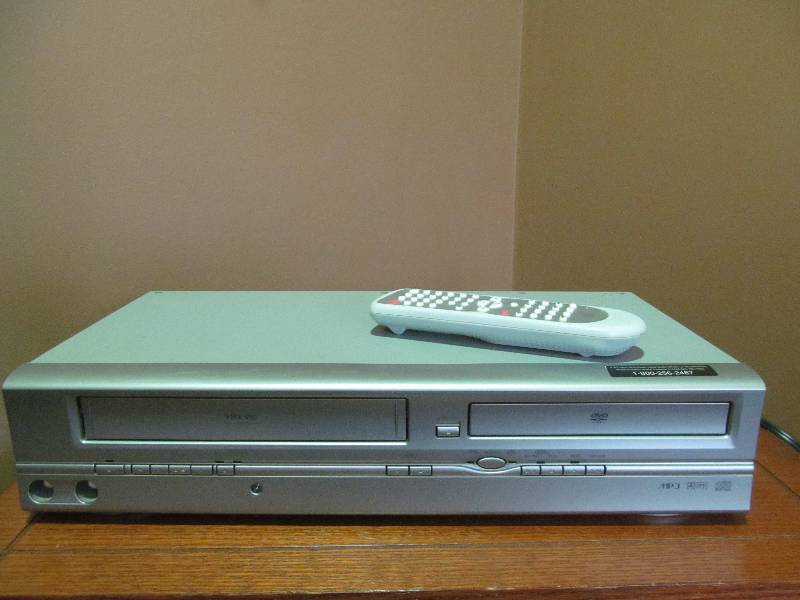 lot 170 image: (Family Room) Emerson VHS DVD Player with remote