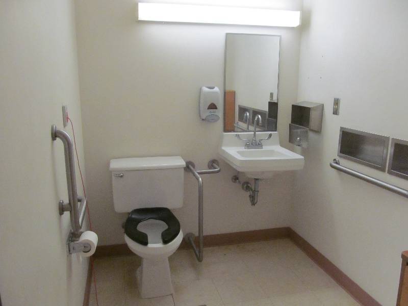 lot 257 image: Rm 26-Bathroom sink, toilet, 3 handrails, towel and soap dispensers