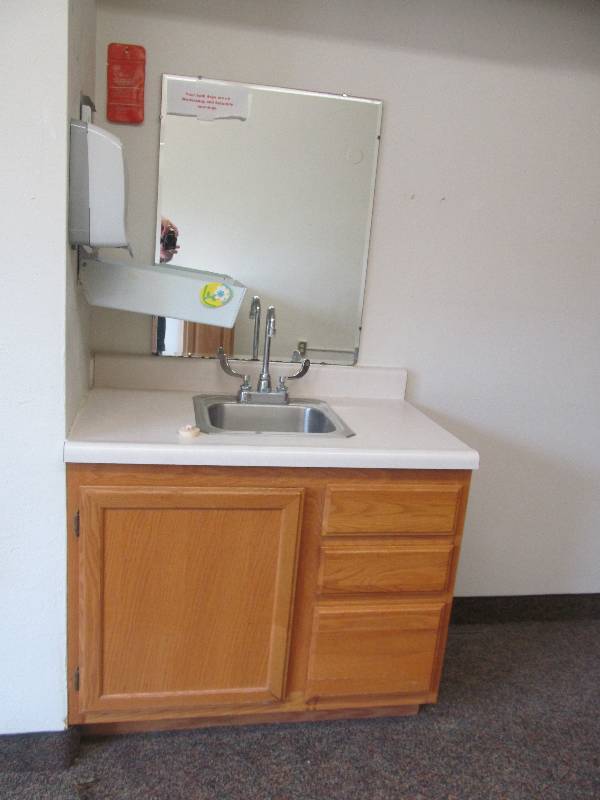 lot 327 image: Rm 21-Vanity, mirror, towel and soap dispenser
