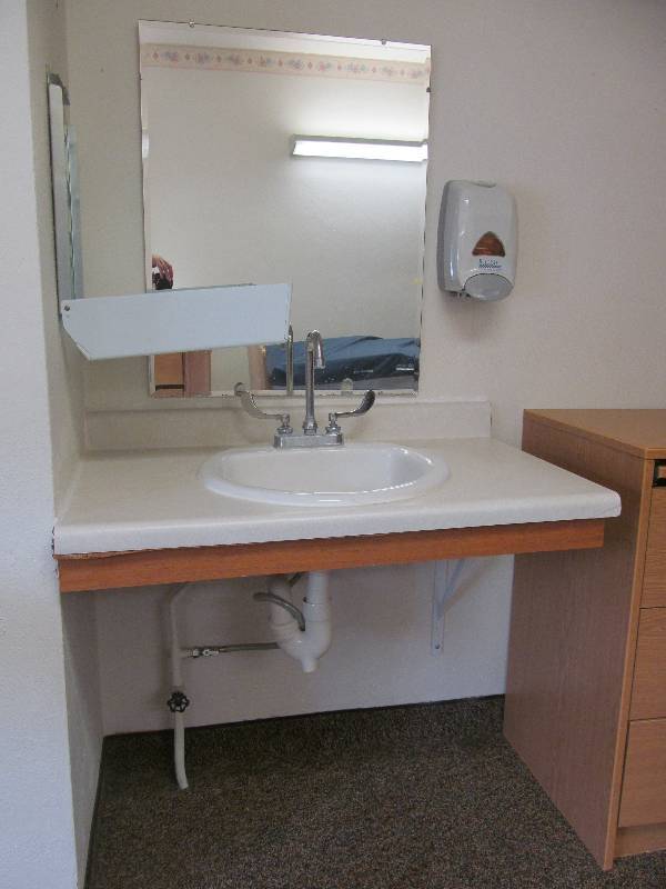 lot 351 image: (Rm 17) Vanity, Mirror, soap and towel dispenser