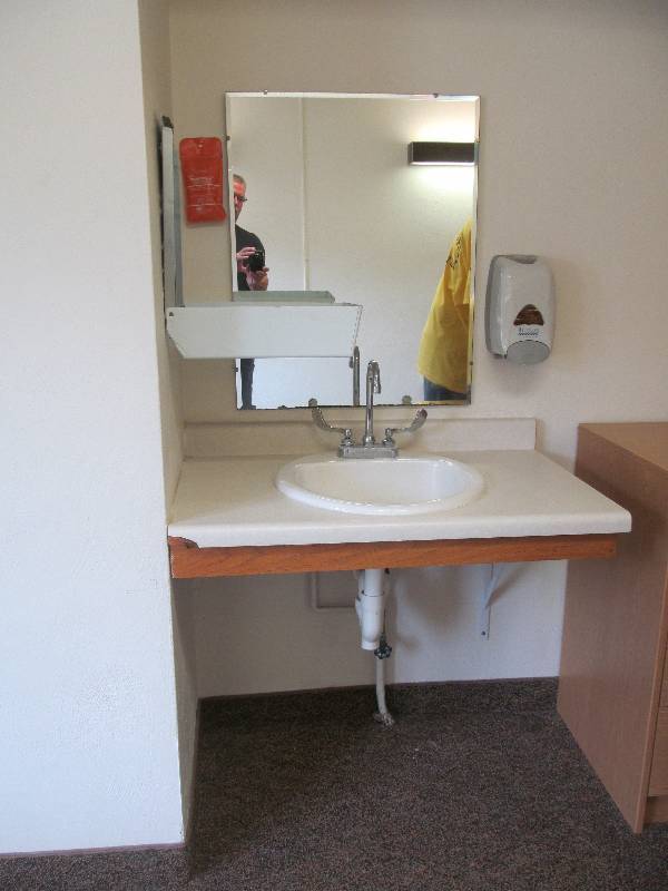 lot 387 image: (Rm 15) vanity, sink, soap and towel dispenser