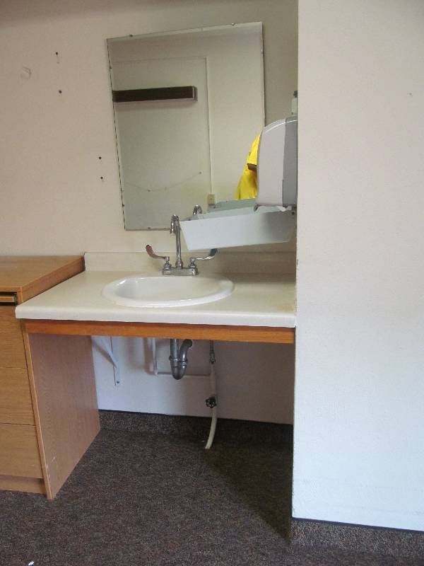 lot 393 image: (Rm 14) Vanity, sink, mirror, soap and towel dispenser