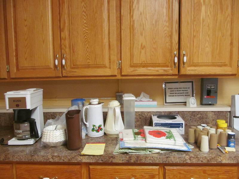 lot 411 image: Cleaning room- Cleaning supplies-Coffee thermos-shaker sets-napkins coffee maker