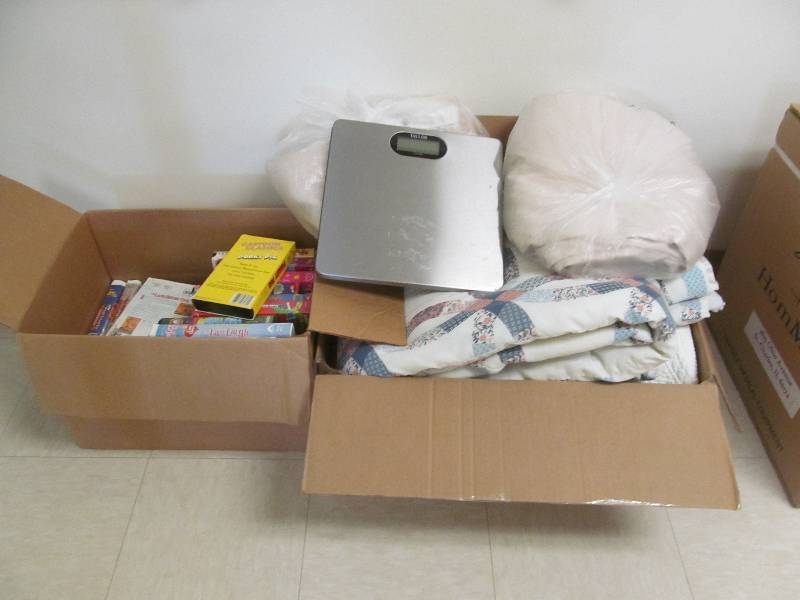 lot 570 image: Basement #2-Quilt room divider curtain, VHS tapes, Digital scale.