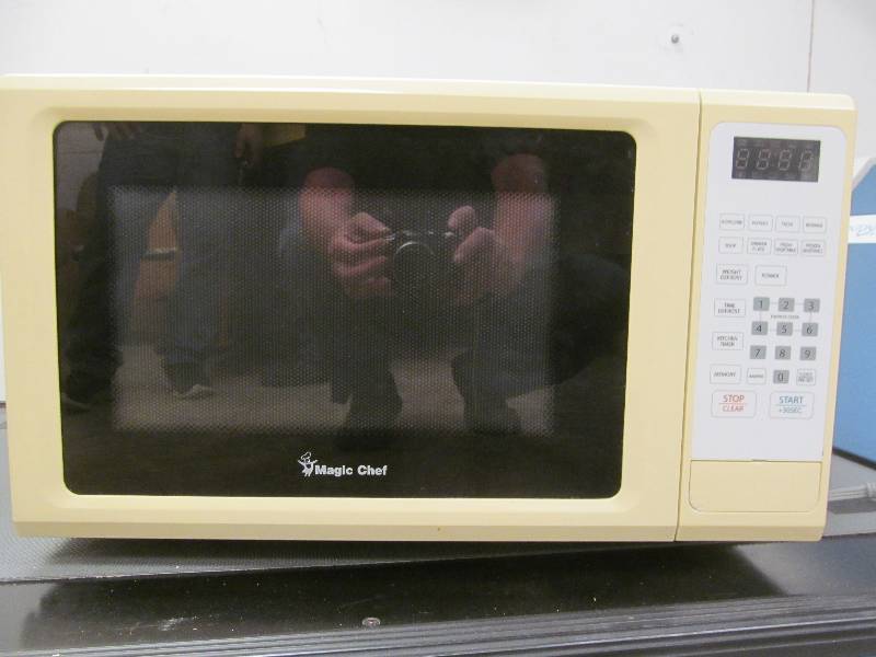 lot 595 image: Basement #2- Magic Chef Microwave