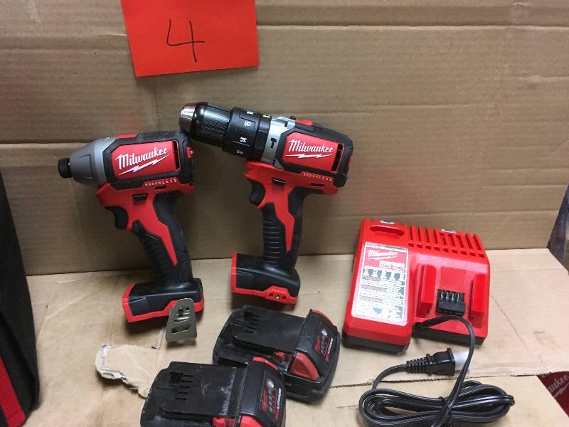 Milwaukee M18 18-Volt Lithium-Ion Brushless Cordless Compact Hammer DrillImpact Combo Kit in working conditions with Free Jobsite Cooler