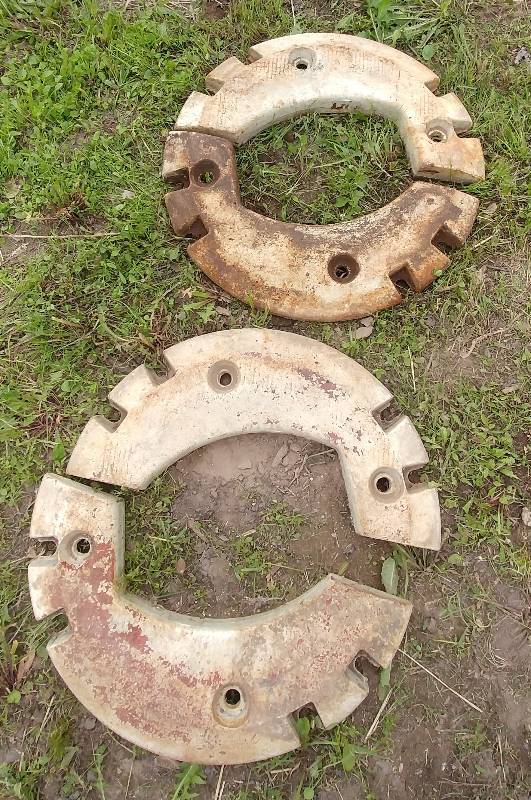 lot 9 image: Vintage Farmall 1206 Tractor Wheel Weight Set