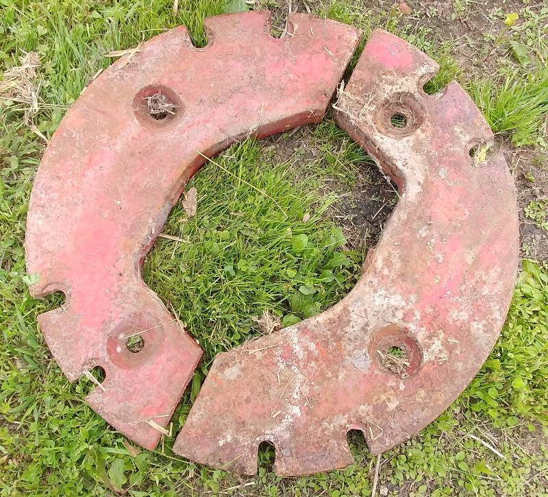 lot 23 image: Vintage Farmall Tractor Wheel Weight Set