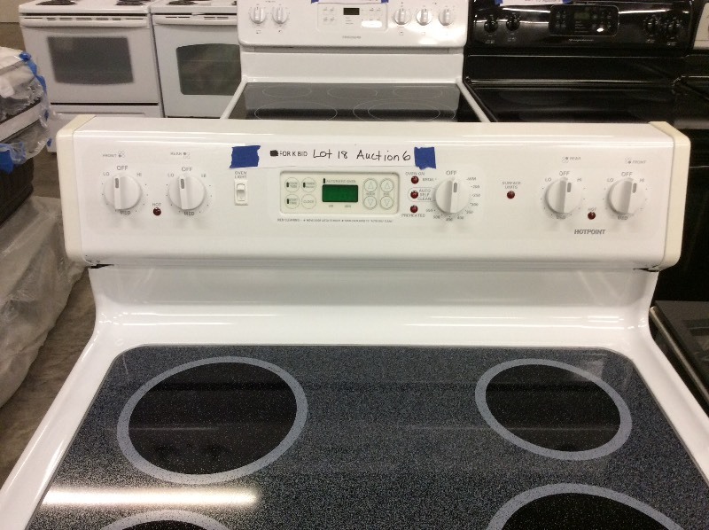 lot 18 image: Hot Point White Glass Top Electric Stove