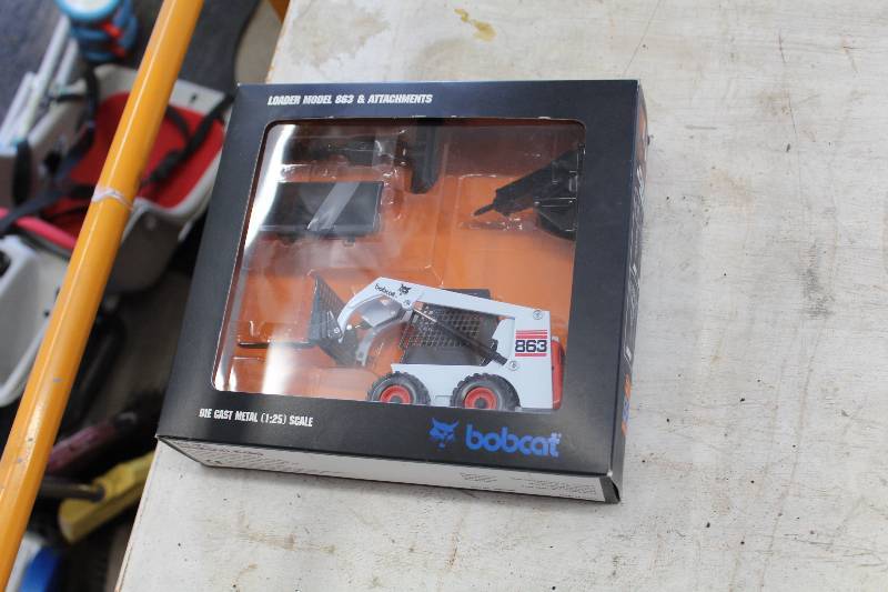 lot 116 image: Bobcat Die Cast Metal 125 Scale Model 863 Loader w Attachments