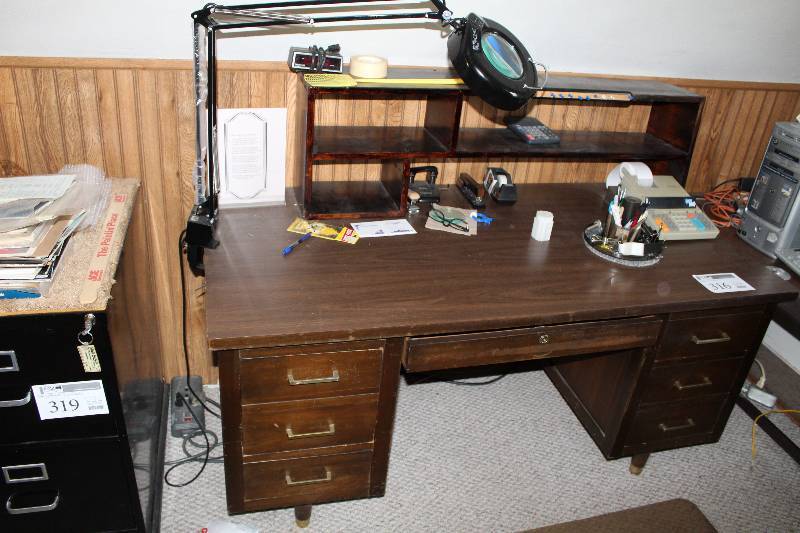 lot 316 image: 7-Drawer Wood Office Desk, Office Supplies, Adding Machine, Clamp Light, Bookcase