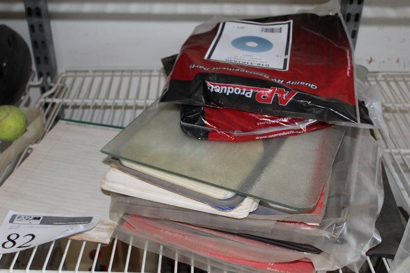 lot 82 image: Mud Flaps, Tools, Bottle Jacks, Chains, Air Filters, Submersible Stop Turn Tail Lights, Funnels, And More