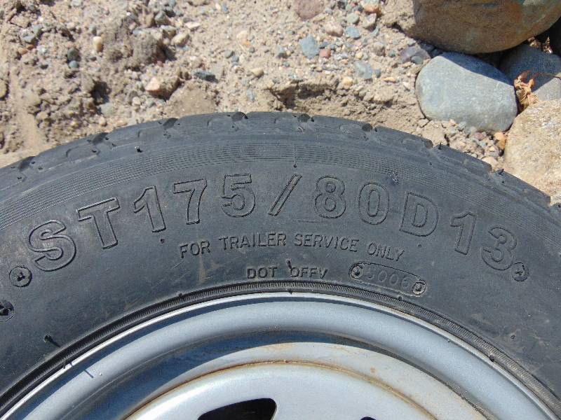 lot 89 image: ST17580 D13 Trailer Tire and 5 Bolt Rim