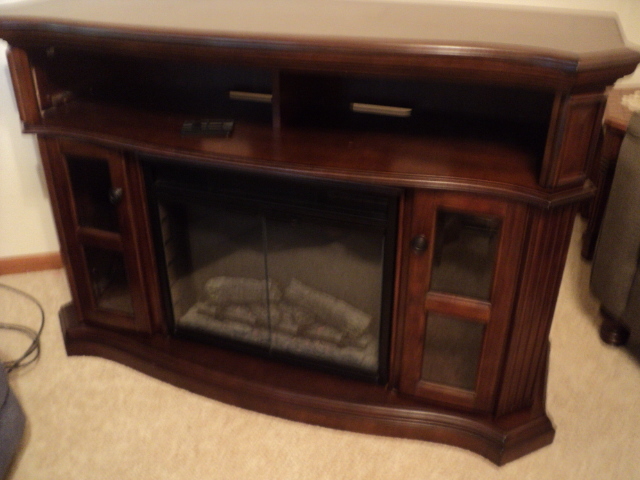 lot 9 image: Entertainment center with working e...