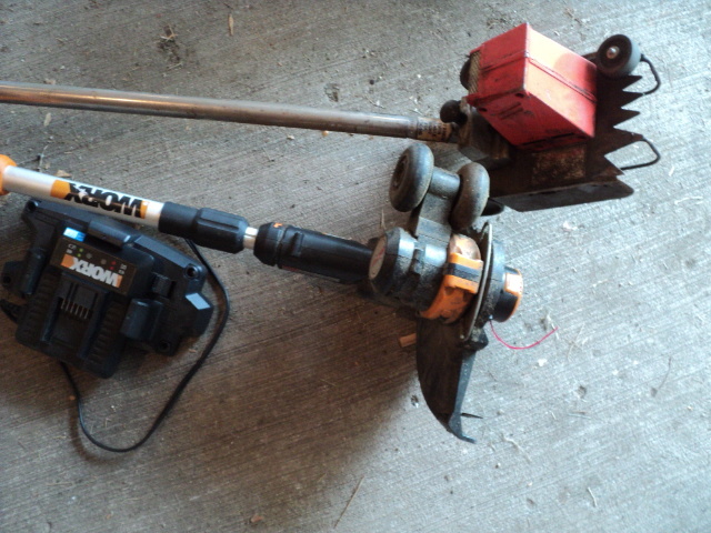 lot 16 image: 2 lawn trimmers, one Worx with batt...