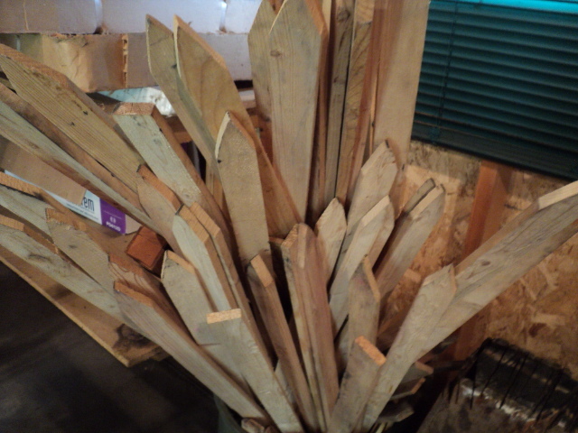 lot 25 image: Trash can full of wood stakes...