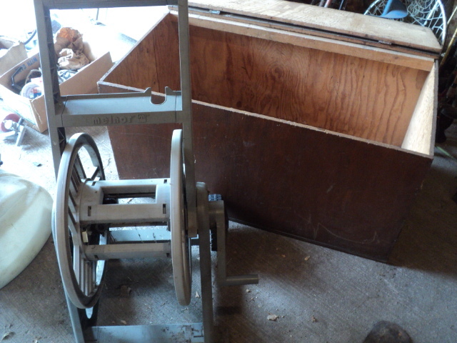 lot 31 image: Wood storage box and hose reel...