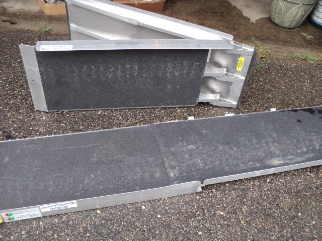 lot 45 image: Aluminum trailer ramps with grip...