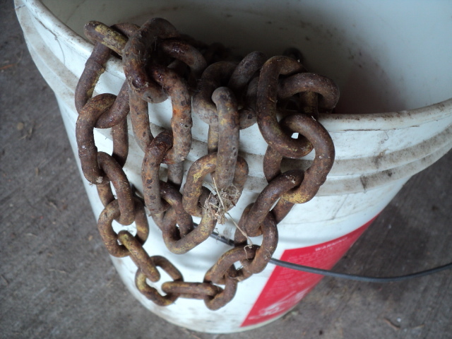 lot 55 image: Bucket of chains...