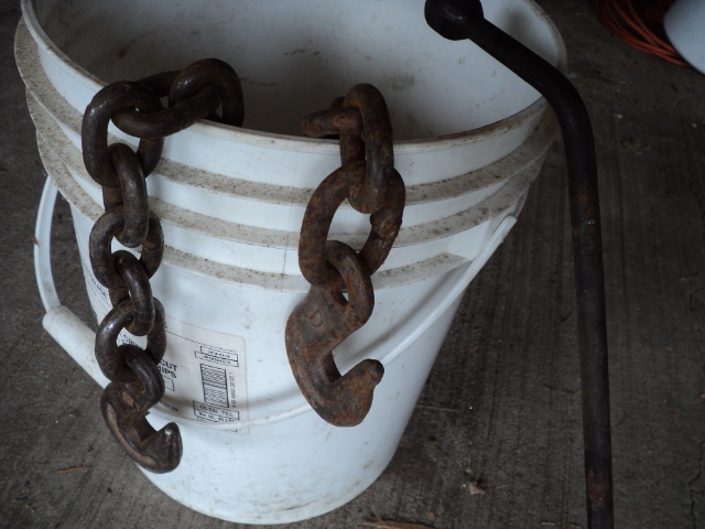 lot 56 image: Heavy tow chain and tire iron...