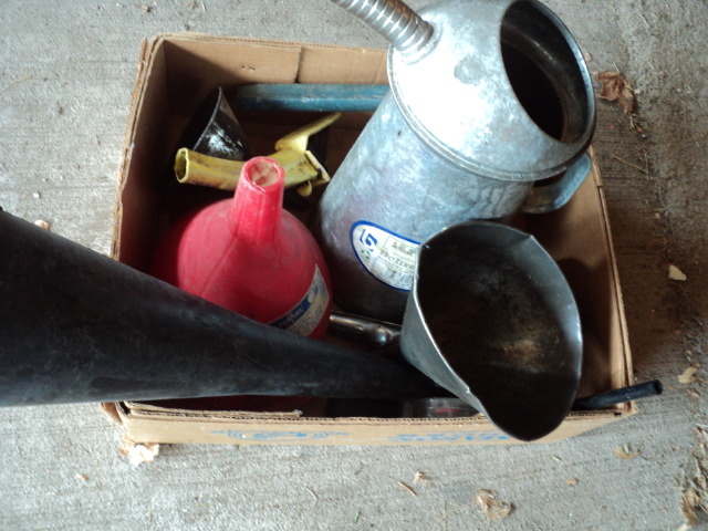 lot 63 image: Oil funnels and cans...