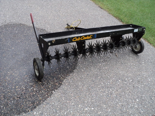 lot 4 image: Cub Cadet areator 4 feet wide...