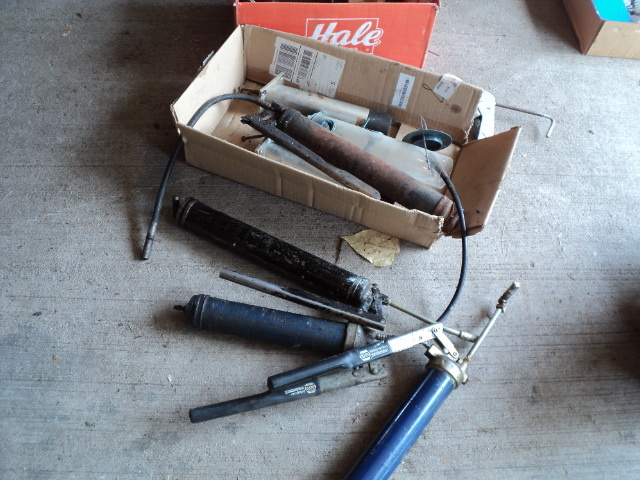 lot 93 image: Lot of grease guns, trailer hitch p...