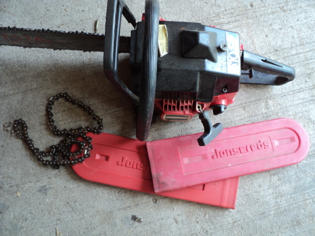 lot 109 image: Jonsered chainsaw, needs a tuneup...