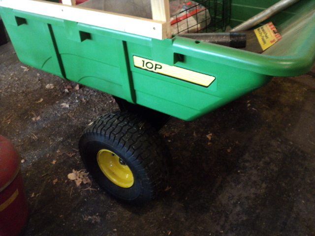 lot 112 image: John Deere plastic wagon, 35 x 43 i...