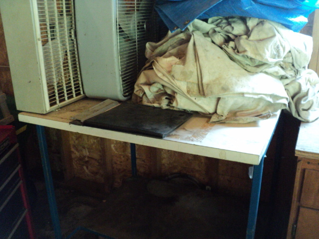 lot 127 image: Work table, canvases, tarp and 2 bo...