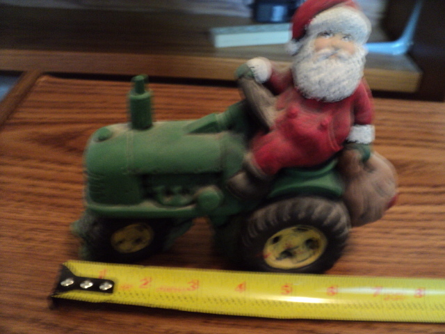 lot 213 image: Santa riding tractor ceramic figure...