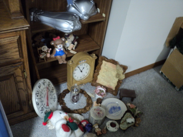lot 276 image: Shelf overflowing with dcor and c...