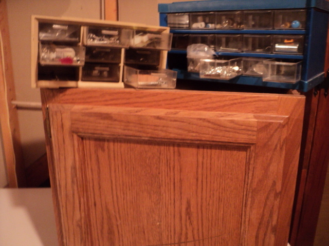 lot 283 image: Wall cabinet with organizers filled...