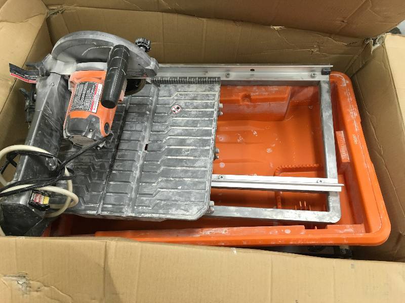 lot 1 image: Ridgid 7 in. Tile Saw with Stand used in working condition