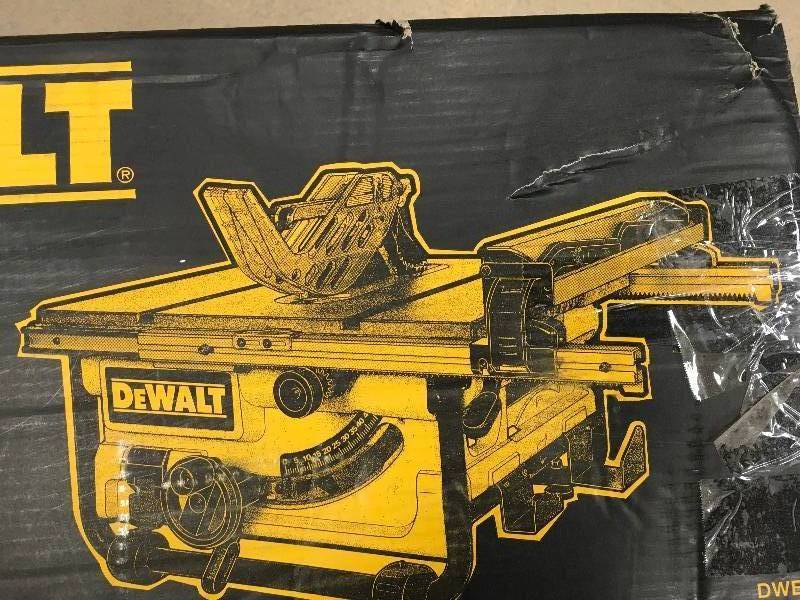 lot 27 image: DEWALT 15 Amp 10 in. Compact Job Site Table Saw with Site-Pro Modular Guarding System Damage & Missing plate in like new working conditions