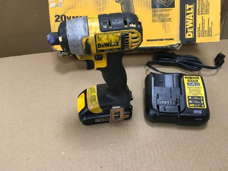 lot 29 image: DEWALT 20-Volt MAX Lithium-Ion Cordless 14 in. Impact Driver with (2) Batteries 1.5Ah, Charger and Contractor Bag USED in working conditions